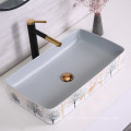 Ceramic Wash Basin White and Orange Table Top Wash Basin